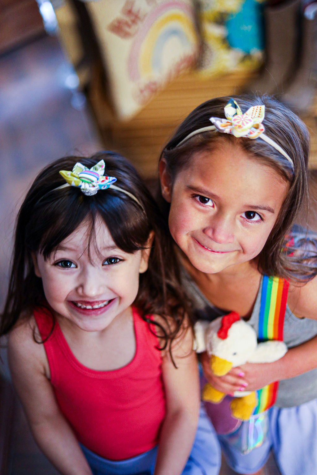 Girls wearing two handmade flower headbands