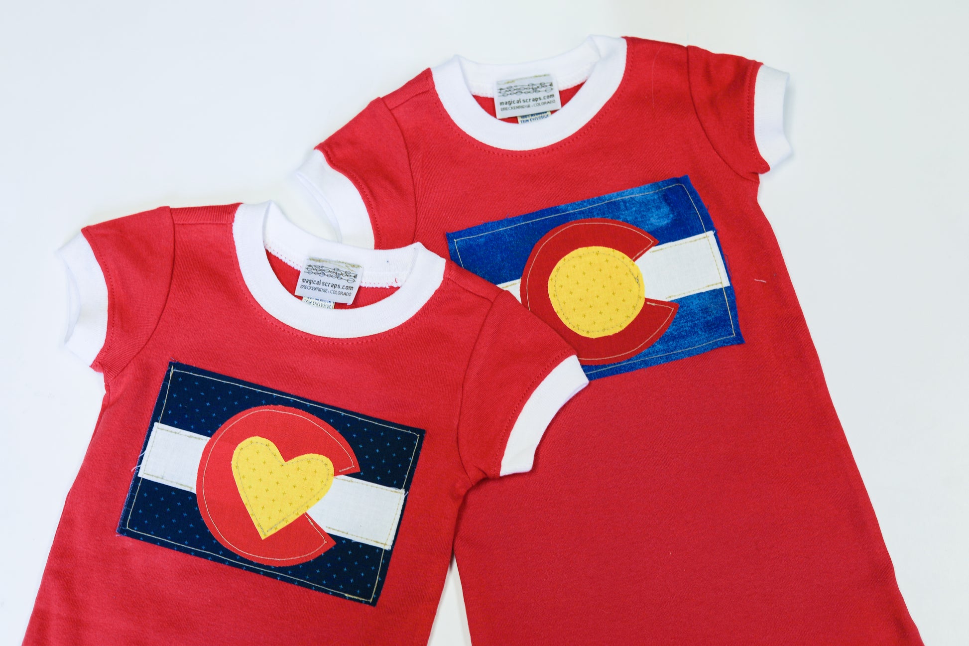 Colorado Flag sewed onto baby rompers 