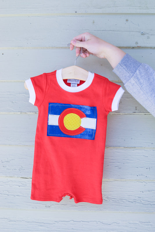 Colorado Flag sewed onto red baby romper 